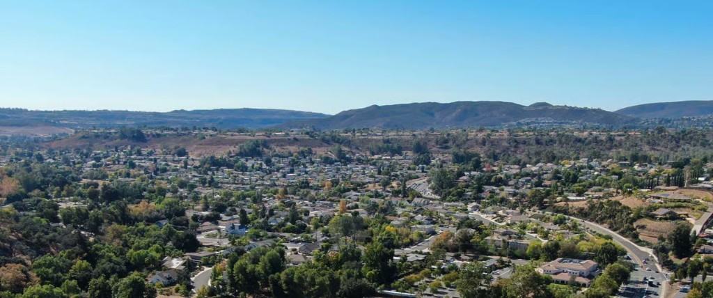 Aerial view of Carmel Mountain Ranch in northern San Diego with green hills, residential neighborhoods, and distant mountains.