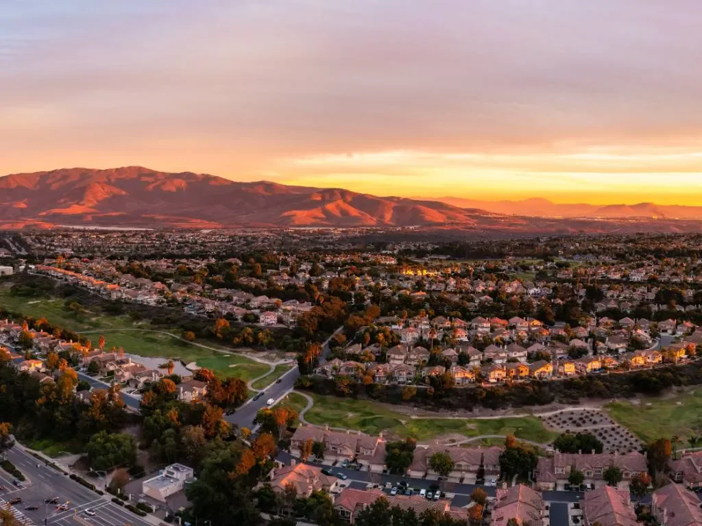 Aerial sunset view of Chula Vista neighborhoods and surrounding hills.