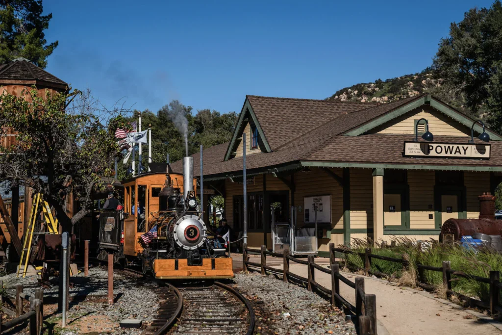Historic Poway railroad station with vintage steam train in Old Poway Park.