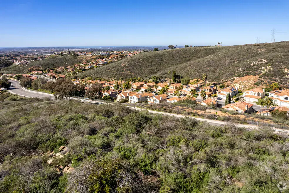 Aerial view of Rancho Penasquitos hillside neighborhoods and surrounding canyon landscape.