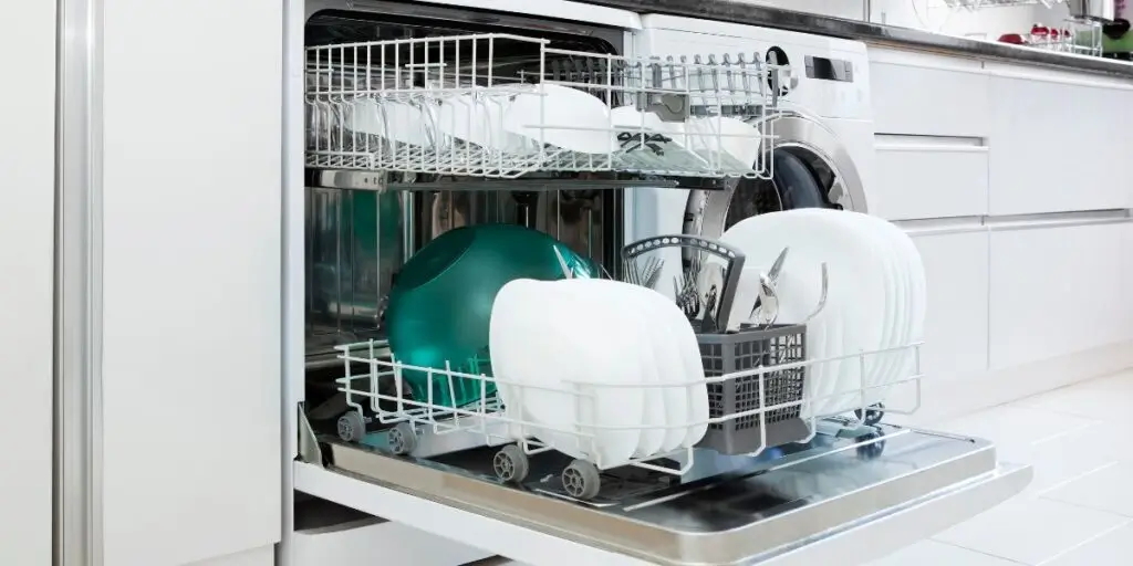 Built-in dishwasher in a modern kitchen during a service visit.