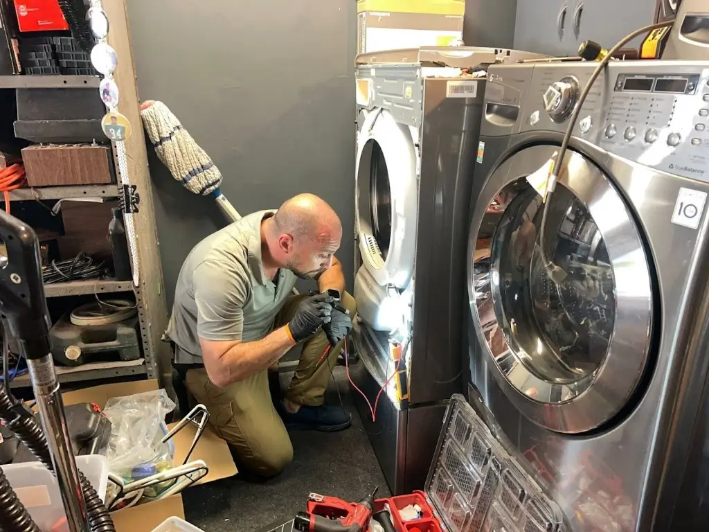Washing machine repair San Diego technician diagnosing front load washer in San Diego