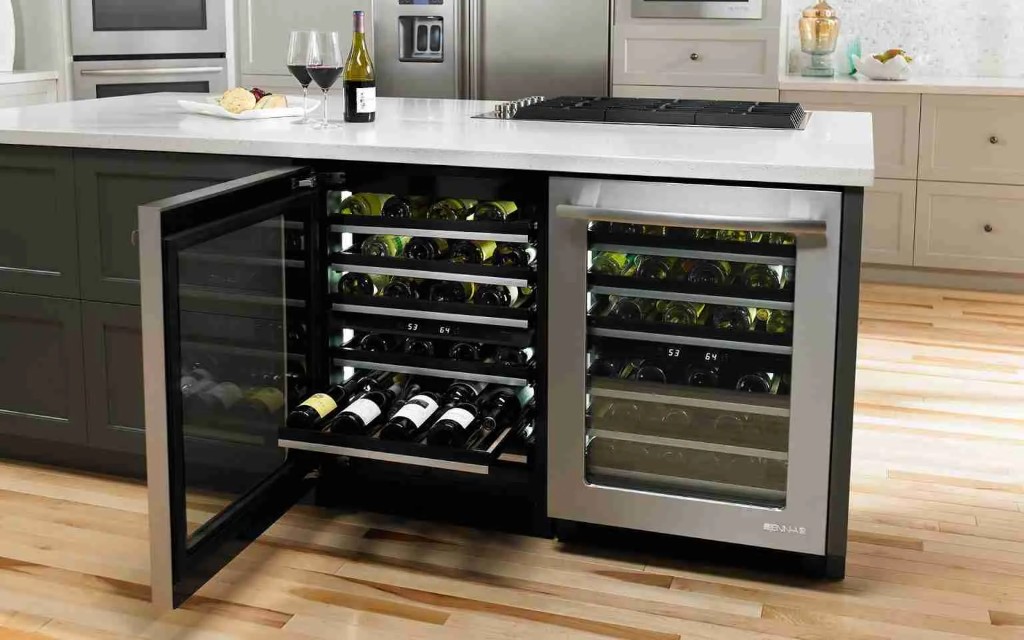 Built-in dual-zone wine refrigerators with glass doors in a luxury kitchen island, digital temperature displays, and wine on the counter.