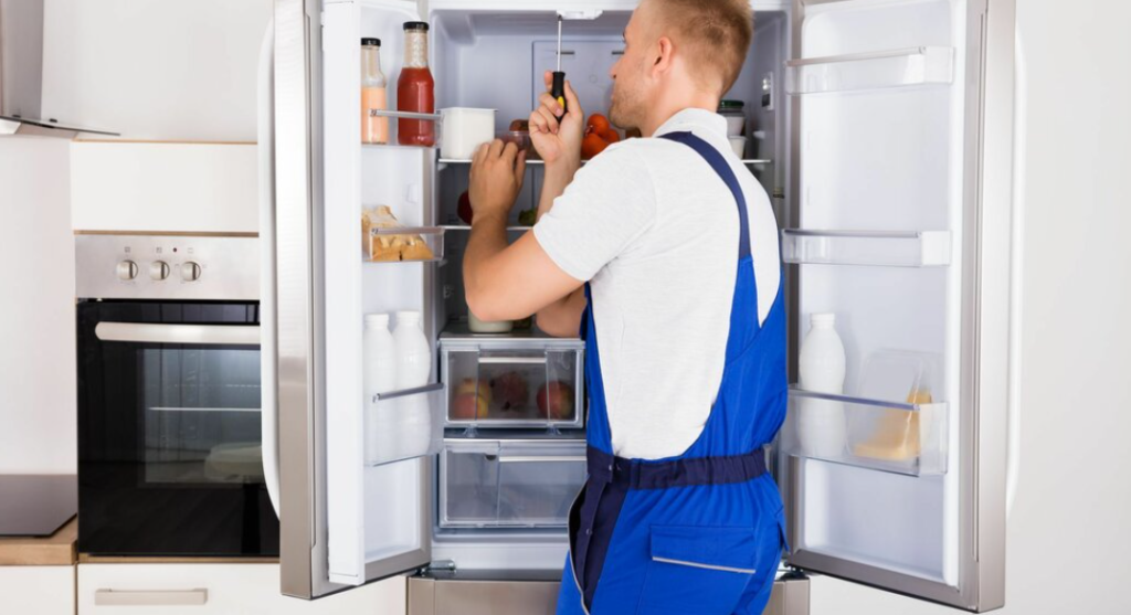 Expert technician diagnosing and repairing an refrigerator