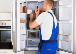 Expert technician diagnosing and repairing an refrigerator